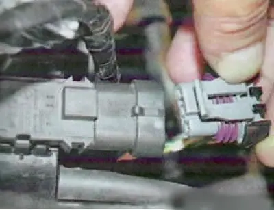 8. Remove the throttle position sensor connector...