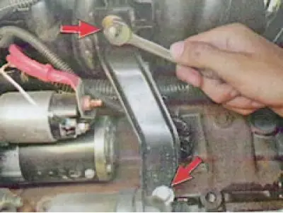 14. ...and remove the wiring from the holder on the engine.