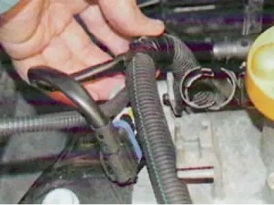 21. ... remove the harness from the front...