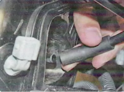 26. ... remove the cable from the bracket hole and move it to the side.