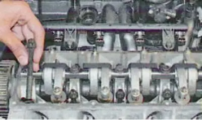 37. Loosen the ten cylinder head mounting bolts in the order shown in the photo...