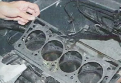 It is better to remove the cylinder head with two people, as it is quite heavy.