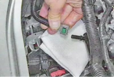 8. Disconnect the wiring harness connectors from the fuel injectors...