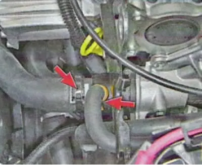 10. Disconnect the wiring harness connectors from the throttle position sensor, coolant temperature…