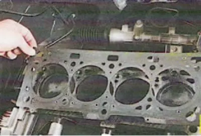 It is better to remove the cylinder head with an assistant, as it is quite heavy.