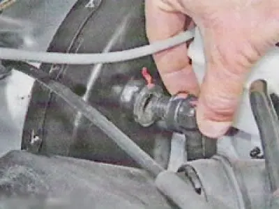 Remove the check valve from the vacuum booster housing (see here).