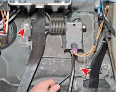 Remove the two spring washers securing the noise insulation pad from the pedal assembly mounting…