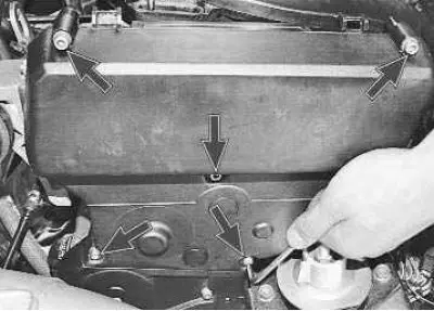 1. Remove the five bolts securing the upper timing belt cover…