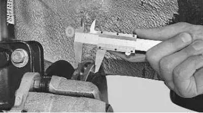 3. Measure the thickness of the disc with a caliper. The minimum permissible disc thickness is 17.8…