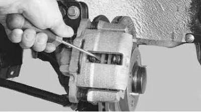 5. Use a screwdriver to check the ease of movement of the pads in the caliper. Make sure they do…