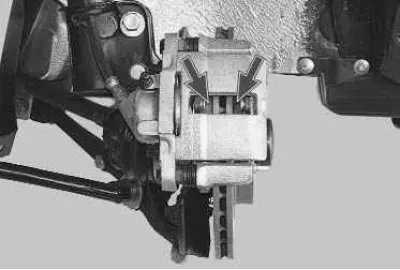 6. Check the condition of the brake pads through the hole in the brake caliper housing. If the…