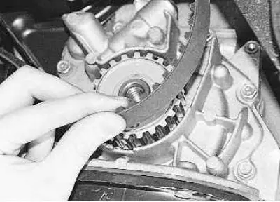 10. Remove the timing belt from the crankshaft toothed pulley.