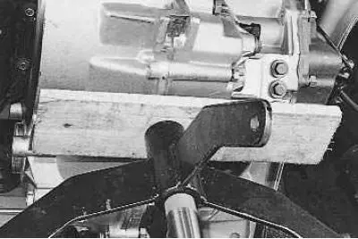 3. Before removing the rear support cushion of the power unit, install a jack or hydraulic stand…