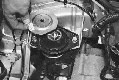5. Remove the upper cushion stop.