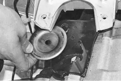 8. Remove the lower cushion stop.