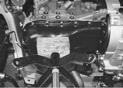 12. Before removing the front powertrain support cushion, install a jack or support under the…