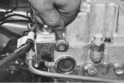 5. Unscrew the mounting bolts with a 10 mm spanner and remove the front...