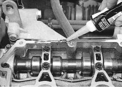 Note: Before installing the cover, clean the mating surfaces of the cylinder head and cover from…
