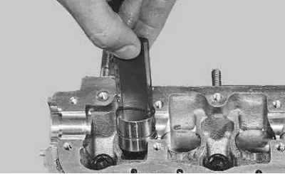 12. Remove the hydraulic valve lifters from the cylinder head holes.