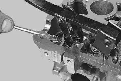 14. Remove the two crackers from the upper spring plate using tweezers or a magnetized screwdriver.…