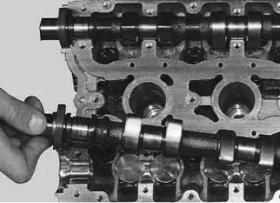26. Install the camshafts in the cylinder head supports so that the cams of the 1st cylinder are…
