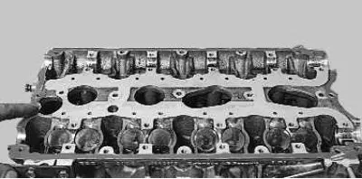 29. Apply a sealant such as «Loctite-574» to the surface of the cylinder head that is mated with…