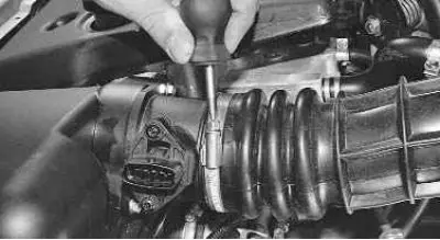 3. Loosen the air supply hose clamp…