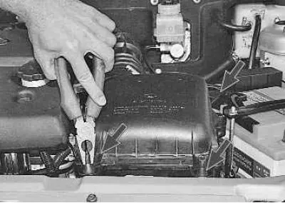 8. Using pliers, squeeze the conical tails of the supports and remove the three rubber air filter…