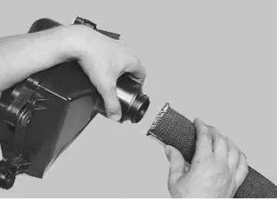 11. If necessary, remove the air intake hose from the adapter spacer.