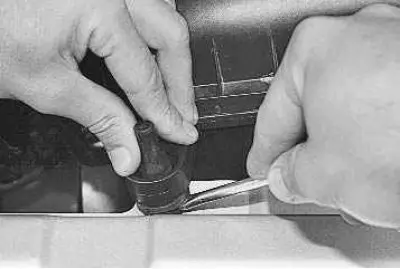 13. When installing rubber mounts in the upper front crossmember, first insert the lower half of…