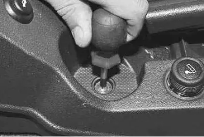 8. …and unscrew the screw securing the upper trim.