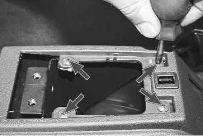 11. Remove the four screws securing the upper trim to the bracket.
