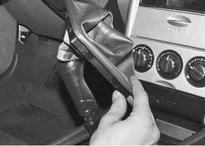 18. Remove the gear shift lever cover.