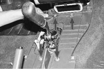 21. Unscrew the four nuts securing the lower trim to the floor…