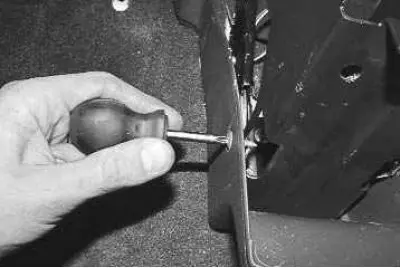 22. …and two screws (left and right) fastening the cladding to the bracket.