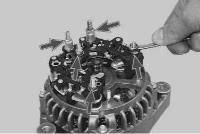 3. Unscrew the three nuts securing the rectifier unit and the two nuts securing the spacer bushings…