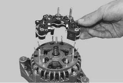6. ...and remove the rectifier block from the generator.
