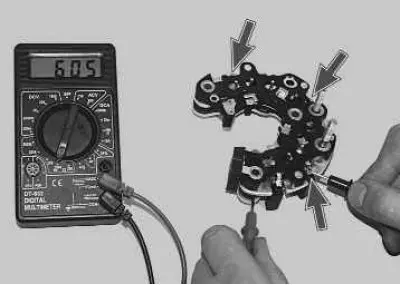 7. Check the «negative» diodes by connecting the «positive» (red) probe of the tester to the…