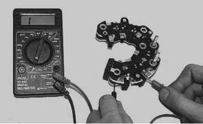 8. Connect the «negative» (black) probe of the tester to the «minus» plate of the rectifier unit,…