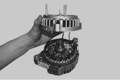 14. ...and, using a screwdriver, remove the generator cover from the contact ring side.