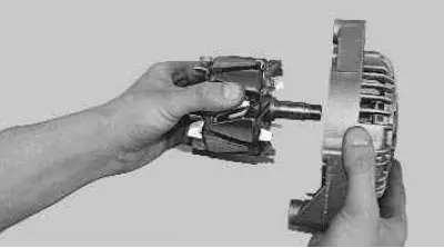 19. Remove the rotor shaft from the bearing. If necessary, screw the pulley mounting nut onto the…