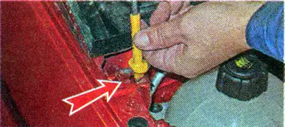 To fix the hood in the open position, release the hood stop from the retaining clamp and turn the…