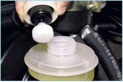 To add brake fluid to the reservoir, unscrew its cap counterclockwise without disconnecting the…